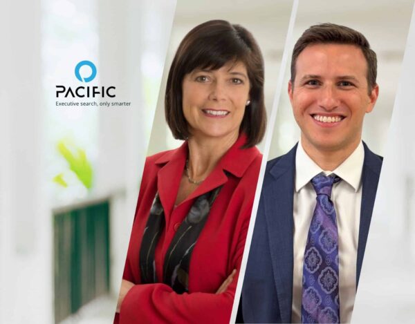 Two professionally dressed people, a woman in a red suit and a man in a blue suit, stand side by side. The Pacific logo and tagline “Executive search, only smarter” appear on the left.